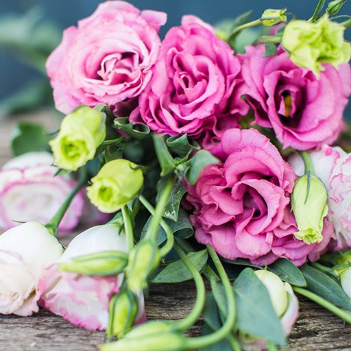 lisianthus-bouquet-on-a-wooden-table-2021-09-03-07-48-23-utc